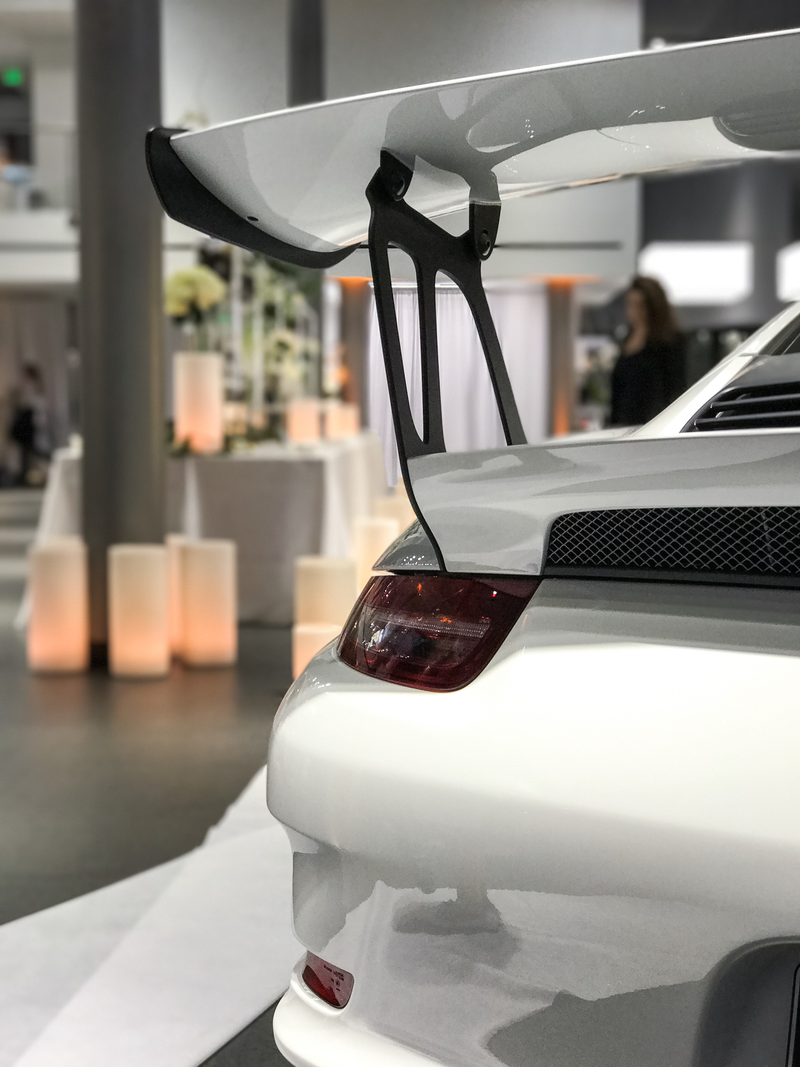 Illustration for article titled This Couple Topped Your Wildest Dreams By Getting Married In A Porsche Showroom
